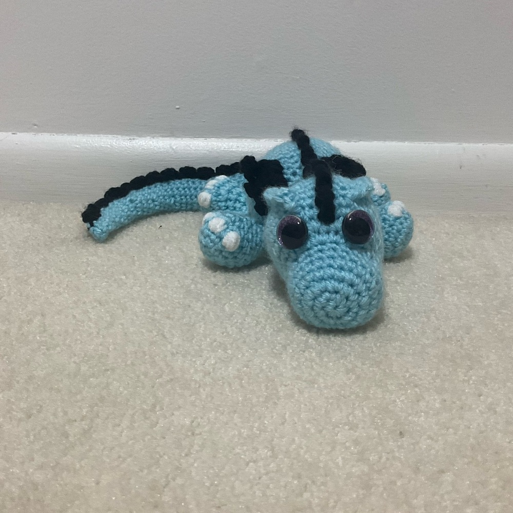 Handmade blue and black crochet dragon